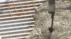 Pouring concrete onto dovetail deck with rebar wire