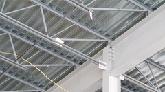 Steel joist intersecting steel girder with standard roof deck