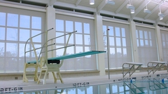 Diving board in natatorium
