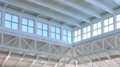 Structural detail of natatorium with painted Versa-Dek® Acoustical roof deck. Rows of window allowing for natural light.