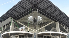 View looking up at the corner of the stadium and its deck-covered canopy