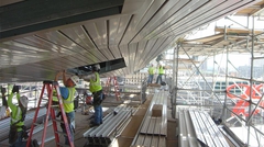 Stadium construction showing workers installing Versa-Dek® dovetail