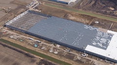 Aerial view on massive warehouse under construction