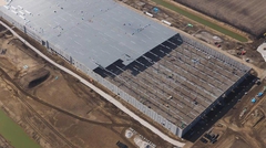 Aerial view showing progress of steel deck installation on warehouse