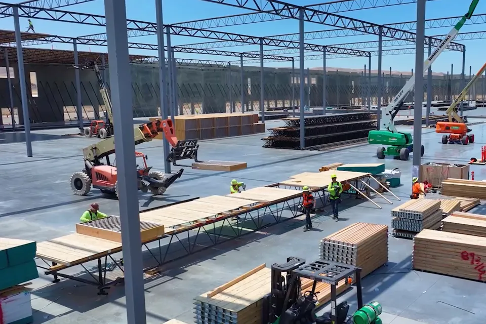 Fabricators erectors on construction site with panelized structures